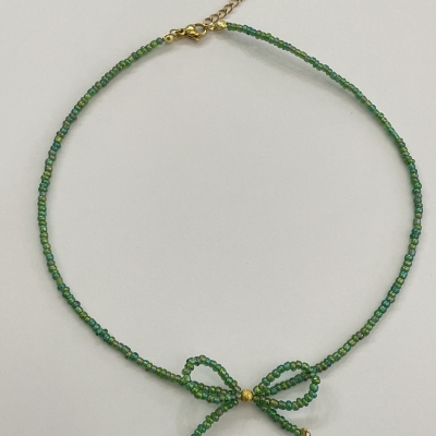 Handmade necklace from beads with bead bow