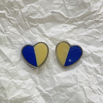 Heart shape polymer clay earrings blue an light yellow color with silver frame and stainless steel back