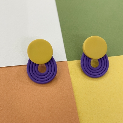 Polymer clay earrings with yellow little circle with purple stripes