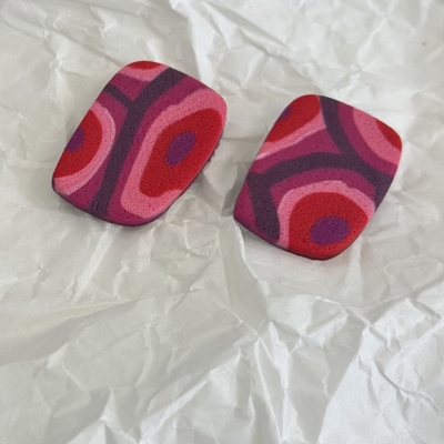 Abstract shape polymer clay earrings with red purple and pink shades