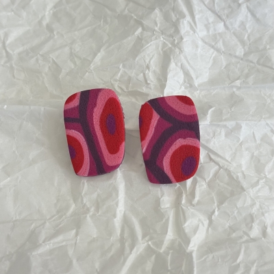 Abstract shape polymer clay earrings with red purple and pink shades