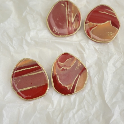 Abstract shape polymer clay earrings with sunset colors and gold details